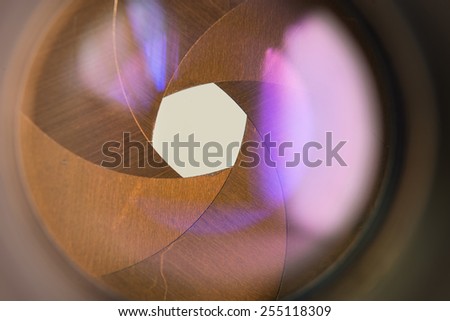 Camera diaphragm aperture with flare and reflection on lens