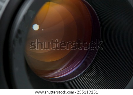 The diaphragm of a camera lens aperture. Selective focus with shallow depth of field. Color toned image