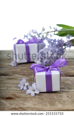 Gift boxes and blue hyacinth on a white background