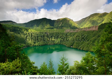 Panoramic photograph overlooking Santiago lagoon, in Sao Miguel Island. The Azores are one of the main tourist destinations in Portugal Royalty-Free Stock Photo #255273295