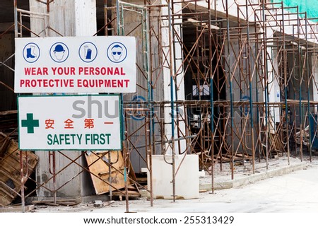Focus on Safety Signage with blurred background of construction site 