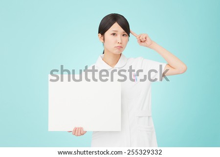 thinking Japanese nurse with Bulletin Board