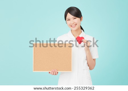Japanese nurse has heart shape with Bulletin Board