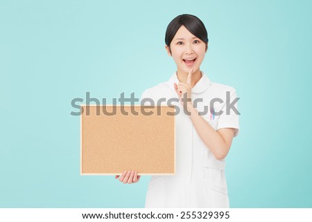 thinking Japanese nurse with Bulletin Board
