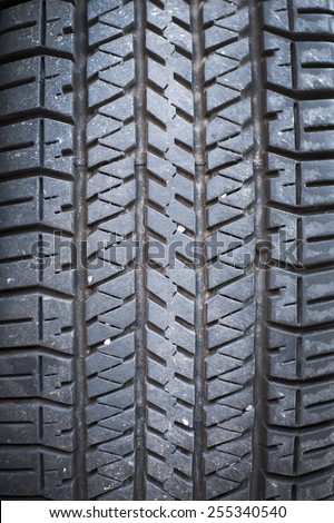 A black rubber tyre, Background.