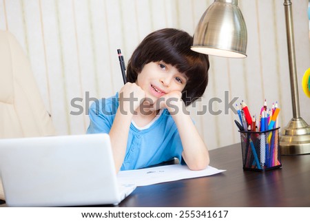 schoolboy doing homework, portrait
