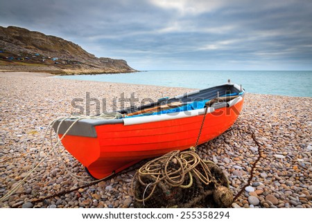 Boat on the beach at Chesil Cove on the Isle Of Portland Dorset England UK Europe