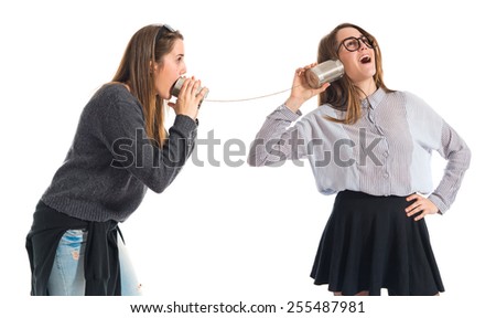 Twin sisters talking through tin phone 