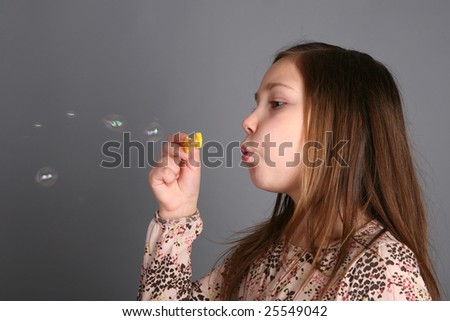 little girl and soap bubbles