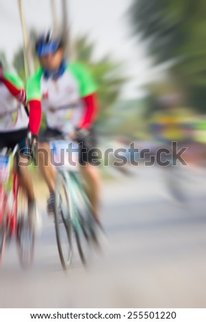 Cyclists blur.
