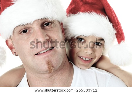 Christmas boy with is father inside a studio white background
