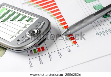 palmtop and pen on a business chart Royalty-Free Stock Photo #25562836