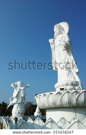 Statue of Guanyin Chinese Goddess with blue sky background