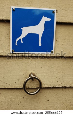 parking for dogs, metal ring and a sign