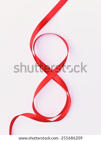 Red gift celebration ribbon in 8 digit with bow. Happy woman's day