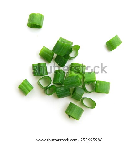 Chopped green onions on white  Royalty-Free Stock Photo #255695986