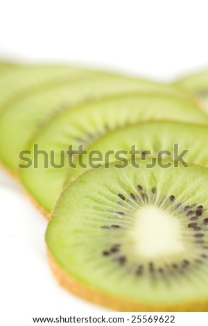 Close-up of sliced kiwi, isolated on white background