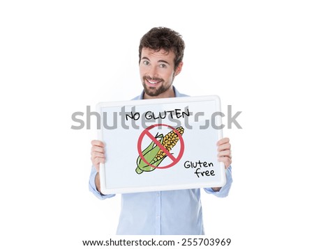 smiling guy exhibiting a board with a cob and the message gluten free