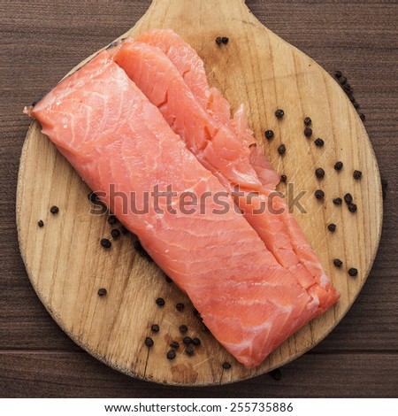 salted trout on the hardboard kitchen table