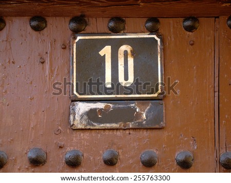 House number ten on pine wood, 10