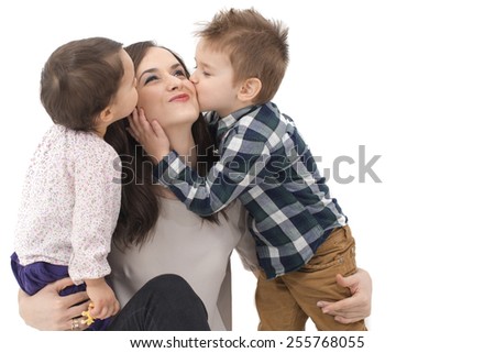 little girl and boy kissing their mother Royalty-Free Stock Photo #255768055