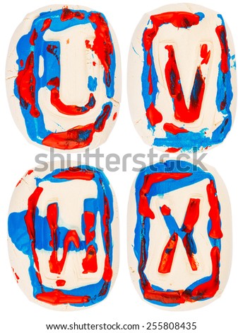 Letters made of white clay  painted with colorful acrylic paints isolated on white
