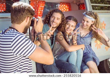 Hipster friends taking a photo on a summers day