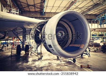 Engine of the airplane under heavy maintenance Royalty-Free Stock Photo #255838942