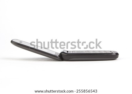 Flip cell mobile cell phone on white background