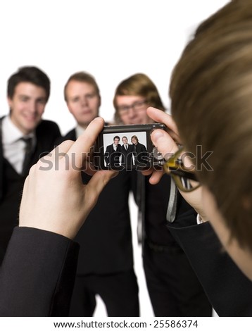 Taking a picture of three men