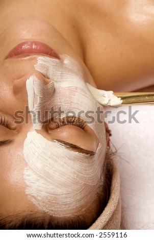cute woman taking car of her face Royalty-Free Stock Photo #2559116