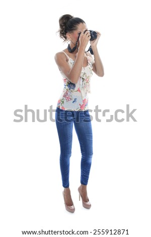 Girl-photographer takes snaps, isolated on white