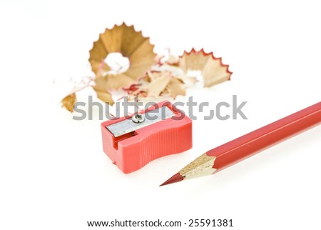Red pencil and sharpener with a shaving
