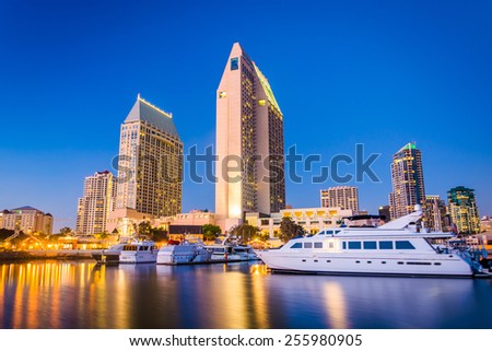 The San Diego skyline and boats at night, seen from Embarcadero Marina Park North, in San Diego, California.