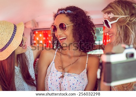 Hipster friends on road trip on a summers day