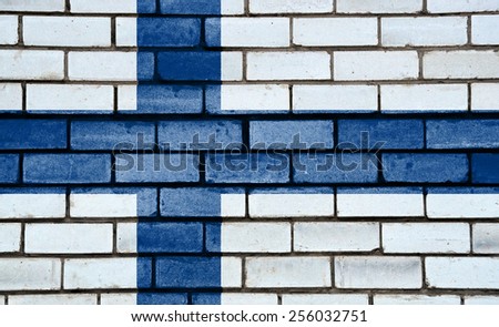 Finland flag painted on old brick wall texture background