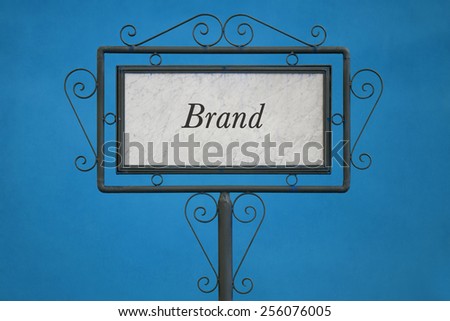 The Word "Brand" on a Signboard. Blue Background.