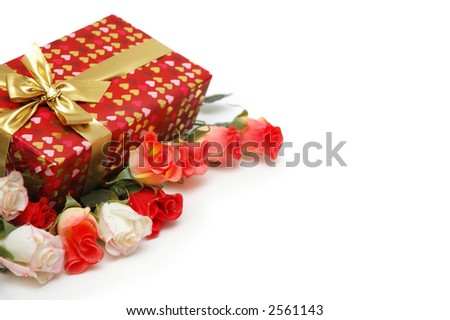 Gift box and roses isolated on white