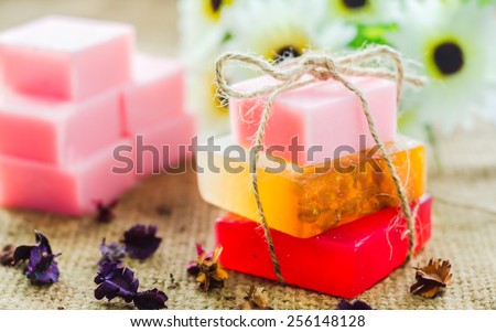 Spa setting with natural soaps and  flower. for aromatherapy. Royalty-Free Stock Photo #256148128