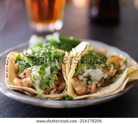 fish tacos with slaw, lemon zest and cilantro