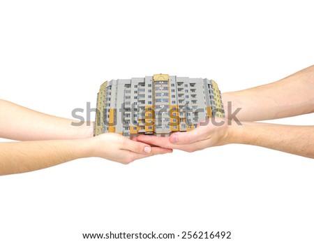 The house in hands isolated on white background 
