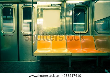 Vintage toned image of empty New York City subway car Royalty-Free Stock Photo #256217410