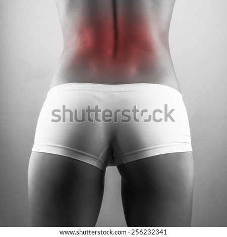 backache woman. black and white photo