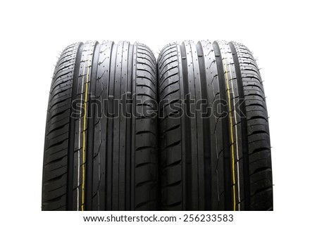 tires with asymmetric tread on a white background