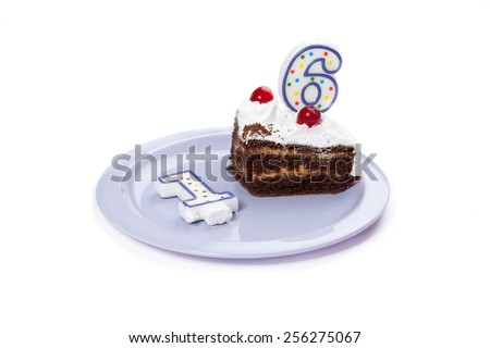 Birthday cake with two candles and piece of cake