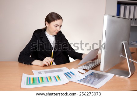 Stressed businesswoman looking  on documents badly