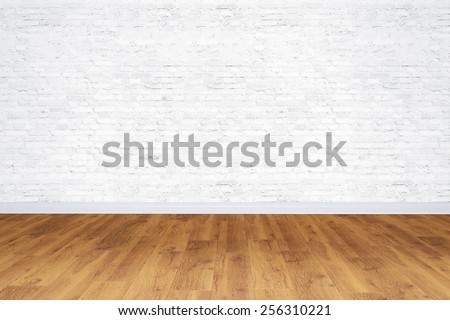 Empty white bricks room with wooden floor Royalty-Free Stock Photo #256310221