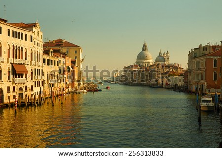 Sea view on Venice grand channel at the morning with historical architecture and on basilica della salute at the horizon in Italy