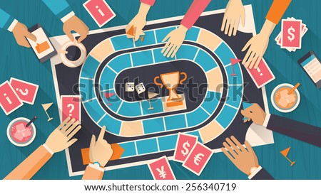 Group of people playing together with a board game Royalty-Free Stock Photo #256340719