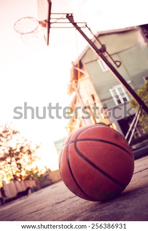 Basketball hoop on street in front of  home on autumn day